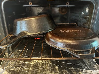 Seasoning a cast iron camp oven.